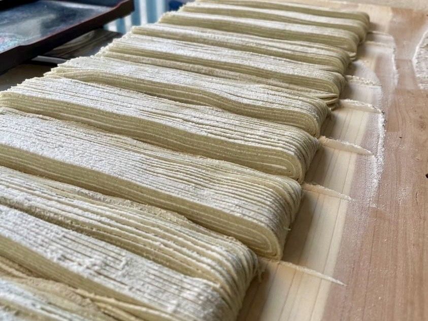 Soba noodles are made by hand from scratch. The finished product is very beautiful.